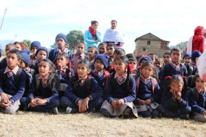 Dhital school children listening to Milton