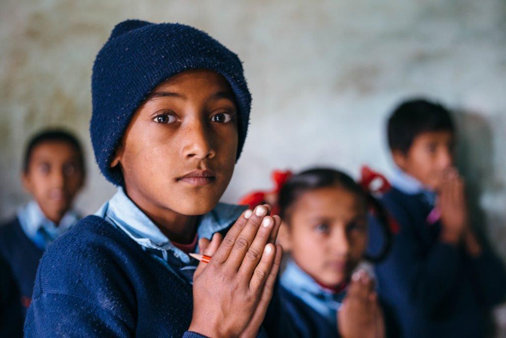 nepal school boy prayer hands